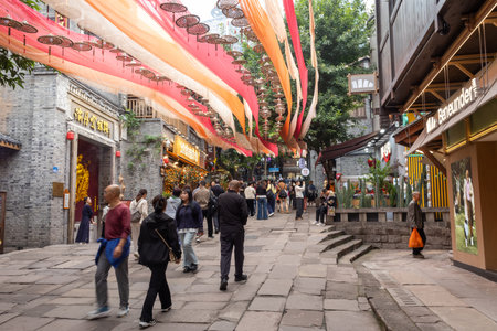 Chongqing, China- 3 Nov 2025: Tourists visit Shibati or Eighteen Stairs, in Chongqing, China.  Shibati is a centuries-old street in Chongqing with traditional houses and stone stairwaysのeditorial素材