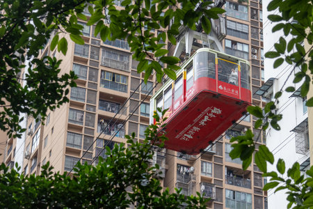 Chongqing, China- 11 Nov 2025: Cable car of Yangtze River Cableway travels along the city in...