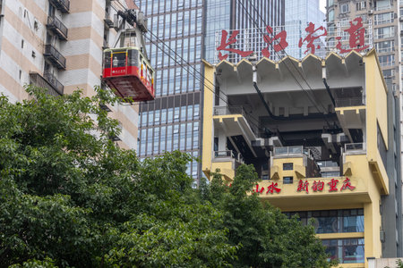 Chongqing, China- 11 Nov 2025: The cable car of Yangtze River Cableway approaching the station in Chongqing, China. The cable car ride treats visitors to sweeping panoramic views of the cityscapeのeditorial素材