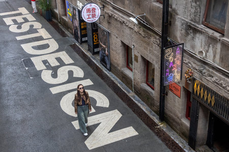 Chongqing, China- 7 Nov 2025: People visit to Erchang Culture and Creative Park in Chongqing, China. It is where creative shops and art studios are lined up, trendy graffiti and literary cornersのeditorial素材