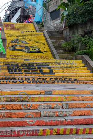 Chongqing, China- 11 Nov 2025: Colourful staircase painted with attractive color in Ciqikou Ancient Town in Chongqing, China. It is a lively ancient town filled with street food and local snacks,のeditorial素材