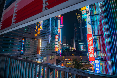 Chongqing, China- 10 Nov 2025: Illuminated by dazzling LED-neon sign, Deyi World in Chongqing, China. It is famous for its unique, multi-layered architecture and Cyberpunk City.のeditorial素材
