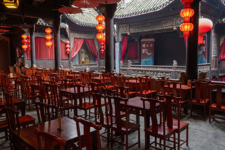 Chongqing, China- 3 Nov 2025: Traditional Chinese performance stage at Huguang Guild Hall in Chongqing, China. uguang Guild Hall is a Qing Dynasty complex showcasing mass migration historyのeditorial素材