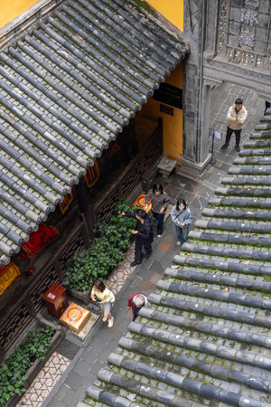 Chongqing, China- 2 Nov 2025: Chongqingâs Louhan Temple which features remarkably architectural design. Built around 1000 years ago, this still-active temple is now sandwiched between skyscrapersのeditorial素材