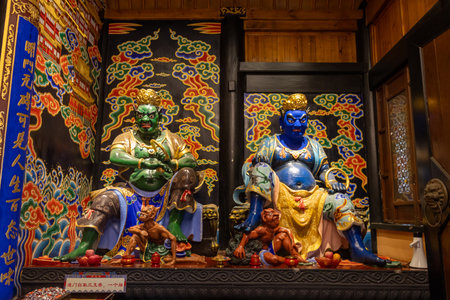 Chongqing, China- 11 Nov 2025: Sculpture of buddha in Luohan Temple at Chongqing, China. The temple retains a traditional layout despite being surrounded by modern skyscrapers.のeditorial素材