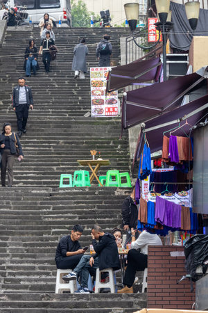 Chongqing, China- 2 Nov 2025: Street view of Chongqing city where people having meal at the...