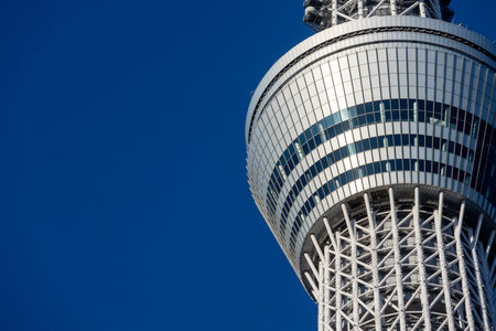 Tokyo, Japan- 17 Dec 2025: Close up look of Tokyo SkyTree observation deck with blue sky....