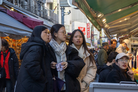 Tokyo, Japan- 17 Dec 2025: Ameyoko shopping street located in the heart of Tokyo, Japan. More than 400 stores line this busy market street that sits under the rail line.のeditorial素材