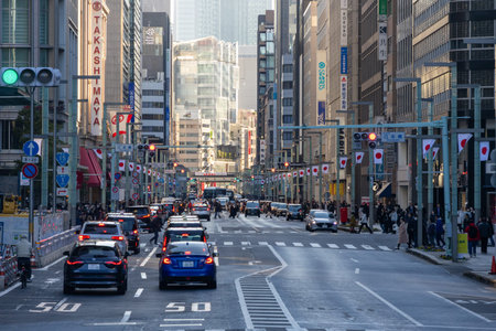 Tokyo, Japan-28 Dec 2025: Busy street and heavy traffic on the Nihonbashi area in Tokyo. Nihonbashi is a major commercial hub, featuring  both historical charm (old alleys) and modern skyscrapersのeditorial素材