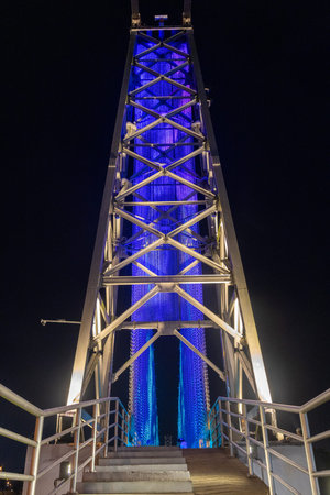 Kuching, Malaysia- 28 Jan 2026: Satok Suspension Bridge in Kuching, Malaysia. With colored lights...