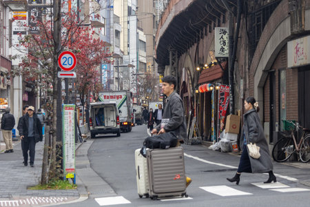Tokyo, Japan - 25 Dec- 2025: Vibrant shopping and dining under its railway tracks around Hibiya...