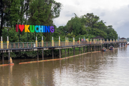 Kuching, Malaysia- 26 Jan 2026: I love Kuching banner along the Sarawak River in Kuching, Malaysia. The sign is typically styled with vibrant rainbow colors and a heart symbolのeditorial素材