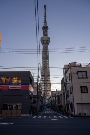 Tokyo, Japan- 17 Dec 2025: View of the Tokyo Skytree Tower from Koume Ushijima-dori Street in Tokyo,...