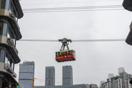 Chongqing, China- 11 Nov 2025: Cable car of Yangtze River Cableway travels along the city in...
