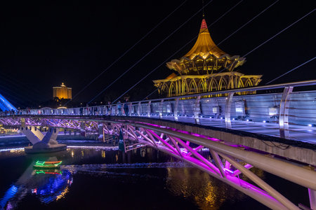Kuching, Malaysia- 28 Jan 2026: Night view of the New Sarawak State Legislative Assembly Building and Darul Hana Bridge, the iconic landmarks of the city of Kuching, Malaysiaのeditorial素材