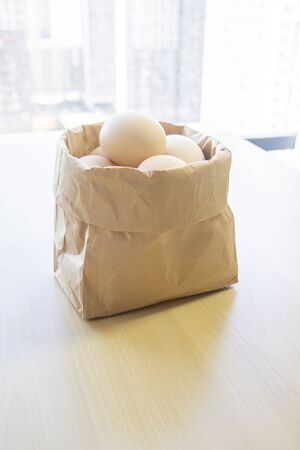 lot of brown eggs in a basketの写真素材