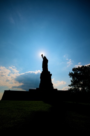 Silhouette of the Liberty Statue in New York Cityの写真素材