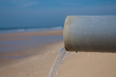 Clean Water pipe at a beachの写真素材