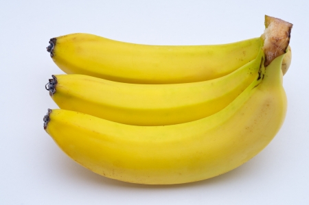 Yellow banana on white backgroundの写真素材