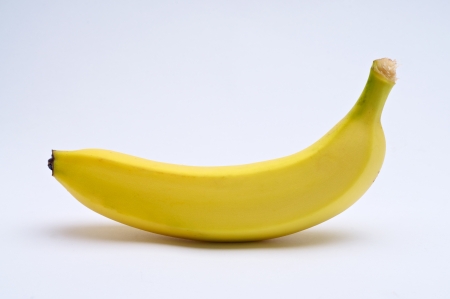 Yellow banana on white backgroundの写真素材
