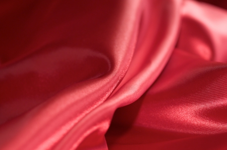 Red silk fabrics backgroundの写真素材