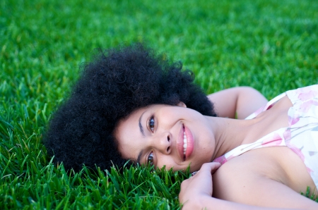Portrait of beautiful african american model with afro look in natureの写真素材