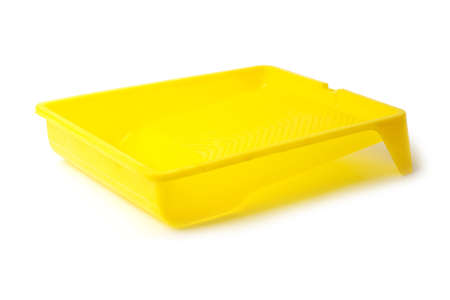 yellow Paint tray isolated on black backgroundの写真素材