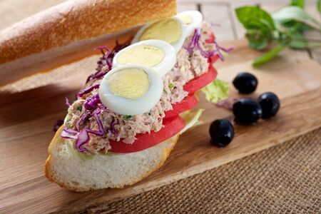 Fresh delicious Tuna Egg Sandwich on cutting boardの写真素材