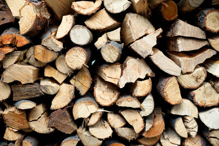 A pile of hard fire wood fence 
