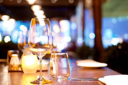 Dinner table set up in a restaurantの写真素材
