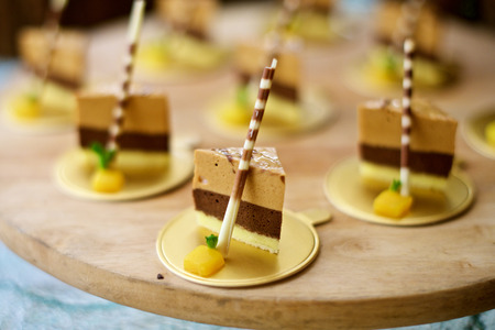 Sweet desserts finger food at buffet in a restaurantの写真素材