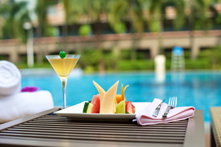 Food Plater with drinks on vacation at the swimming poolの写真素材