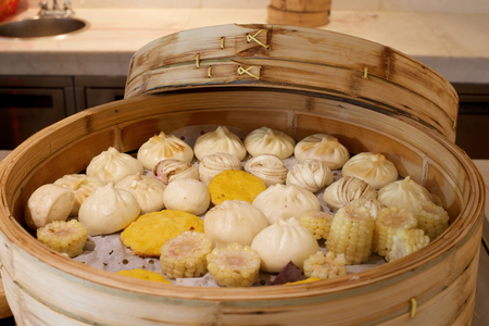 Assorted Chinese buns in large bamboo steamerの写真素材