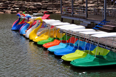 Row of paddle boats in a public park.の写真素材