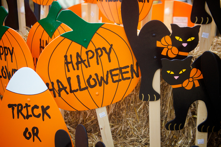 Halloween decorative pumpkins, candy corn and black cats の写真素材
