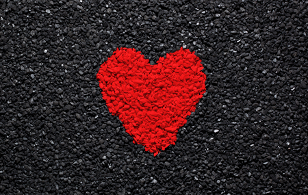 Red heart on the black background, stones, gravel and shingle, love wallpaper, valentineの写真素材