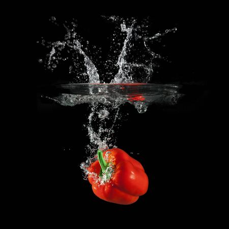 Red bell pepper on blackの写真素材