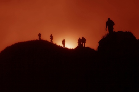 people on the mountaintop when sunrise
