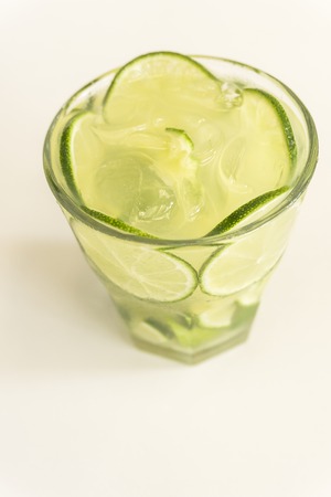 Glass of traditional brazilian drink, caipirinha with lemonの写真素材