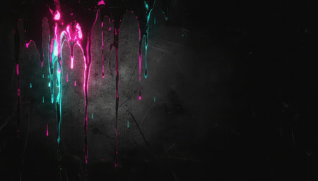 Colorful paint splashes on a black background with copy space.の素材