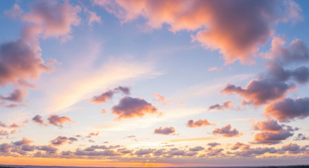 Beautiful cloudscape at sunset. Panoramic view of the sky.の素材