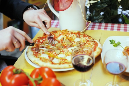 Italian pizza with ketchup, cheese and mushroomsの写真素材