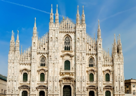 Milan Duomo cathedral ornate gothic spires moon blue sky Italyの写真素材