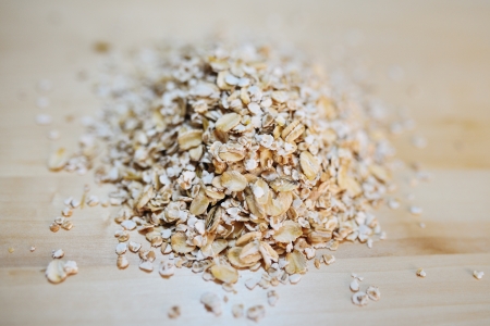 heap of oat flakes on a tableの写真素材