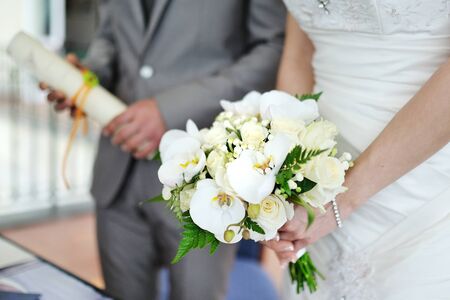 Wedding bouquet held by brideの写真素材