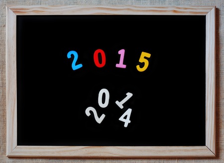 happy new year 2015 replaces 2014 concept on blackboardの写真素材