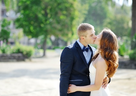 romantic bride and groom couple kissing in wedding dayの写真素材