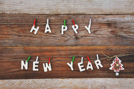 happy new year and christmas tree decoration on wooden backgroundの写真素材