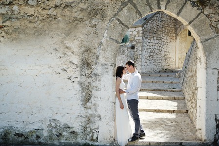 beautiful romantic tender couple in wedding day in Sperlonga, Italyの写真素材