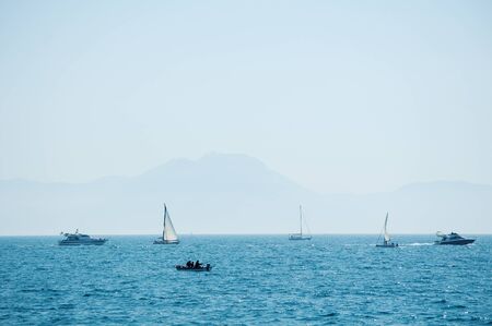 Naples, Italy - blue sea and boats on a summer dayの写真素材